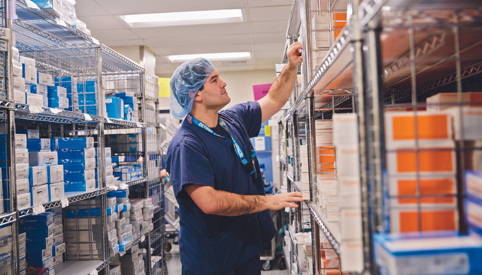 A surgical technology student works in the supply room at Newton-Wellesley Hospital