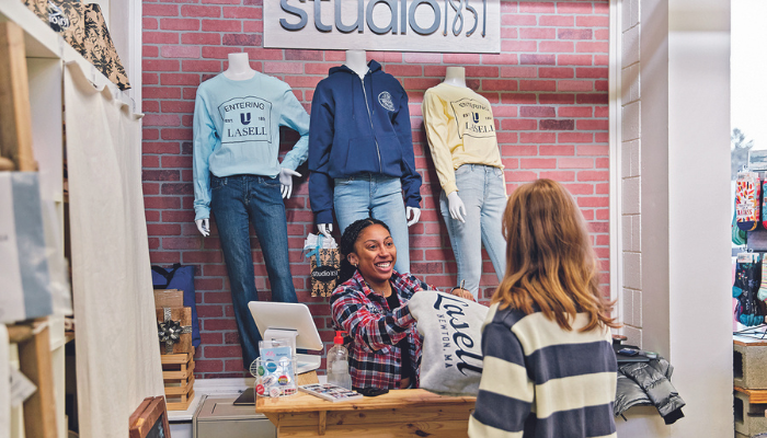 Students work at studio1851, Lasell University's student-run on-campus boutique