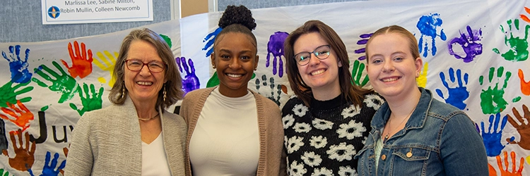 faculty member with three female students