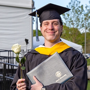 grad student with diploma