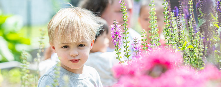 Preschool boy with spring flowers
