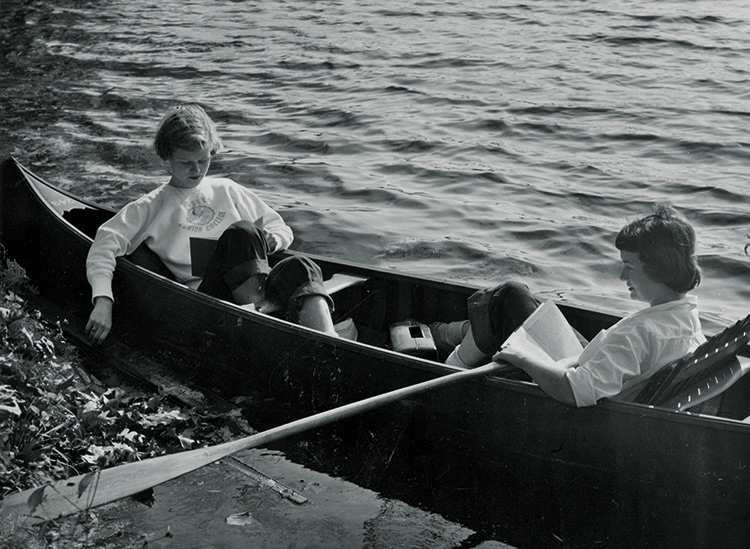 There are more ways to enjoy Lasell's canoes beyond River Day! Mid-century Lasell students enjoy a day on the Charles with a good book.