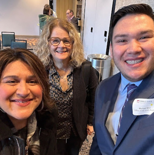 Michael Woo '23 with Lasell community members