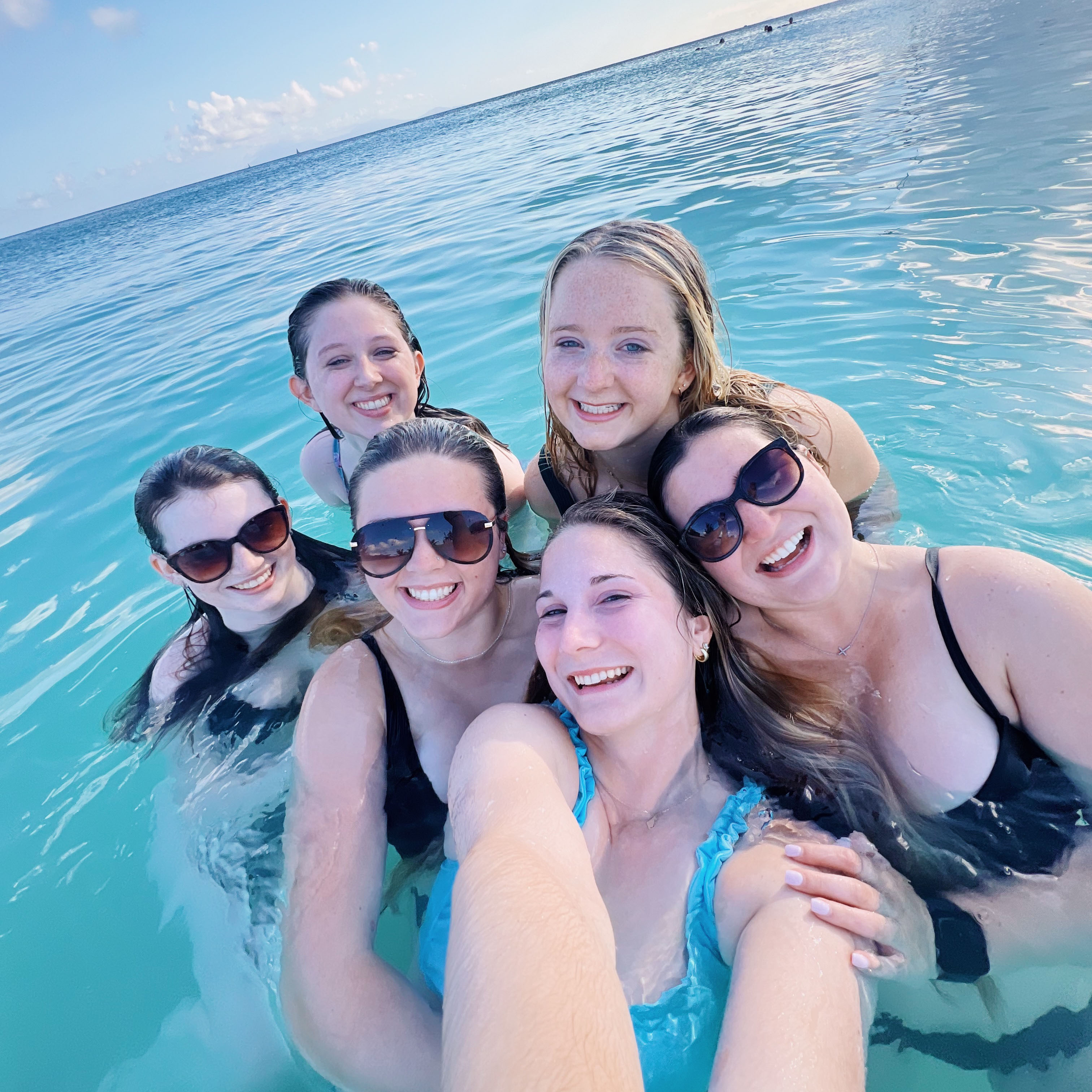 Lasell students in ocean in Antigua
