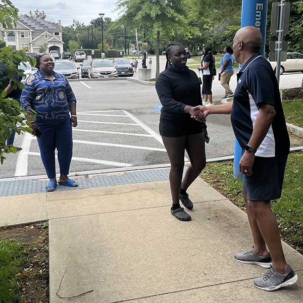 President Turner shaking new student hand on move in day